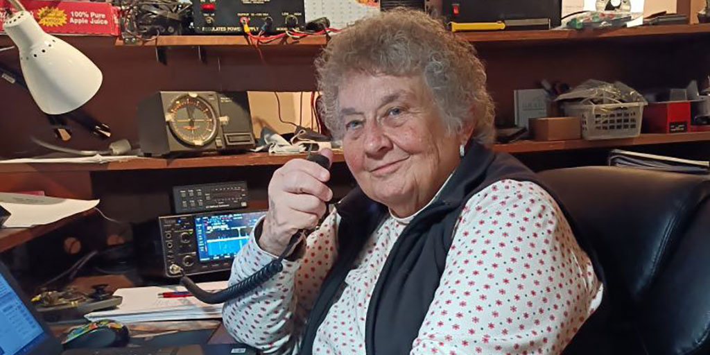 Barbara Yasson sits at her home ham radio station.